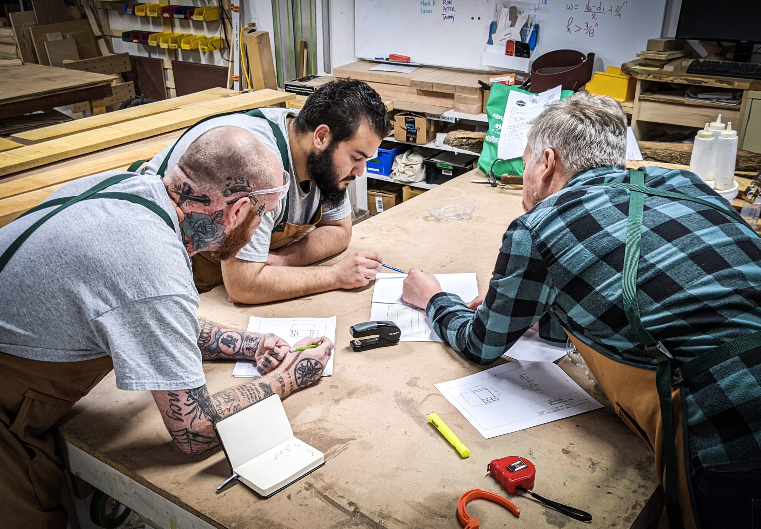 woodshop members planning a new project