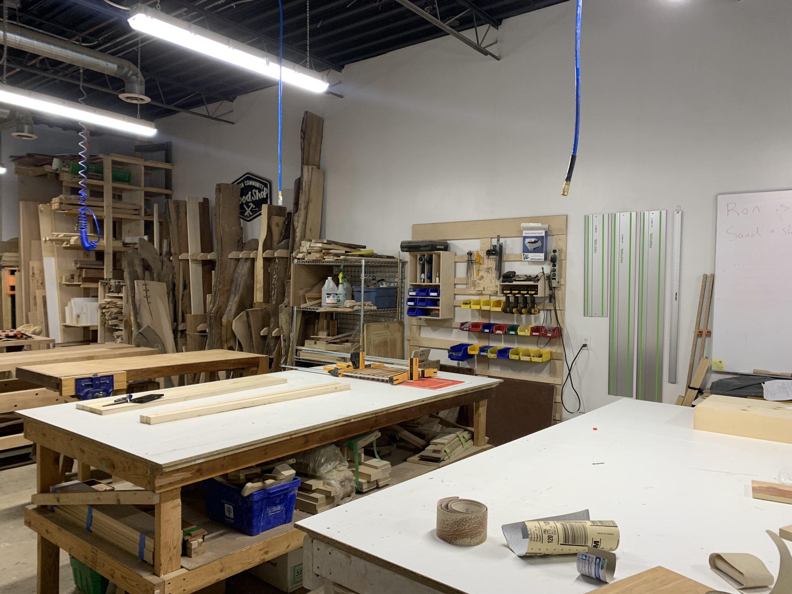 Interior of the London Community Woodshop with tables and tools