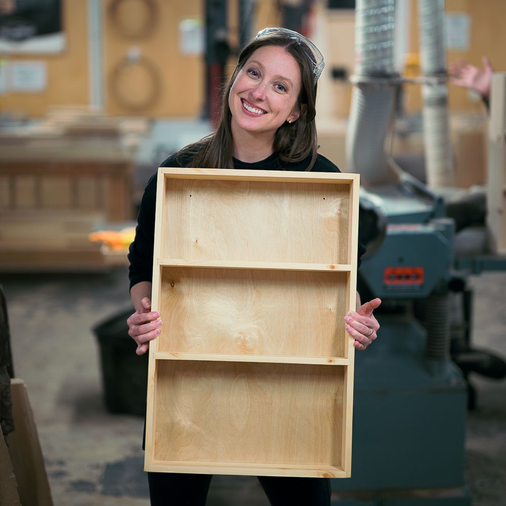 Woodworking 101 student with her finished project