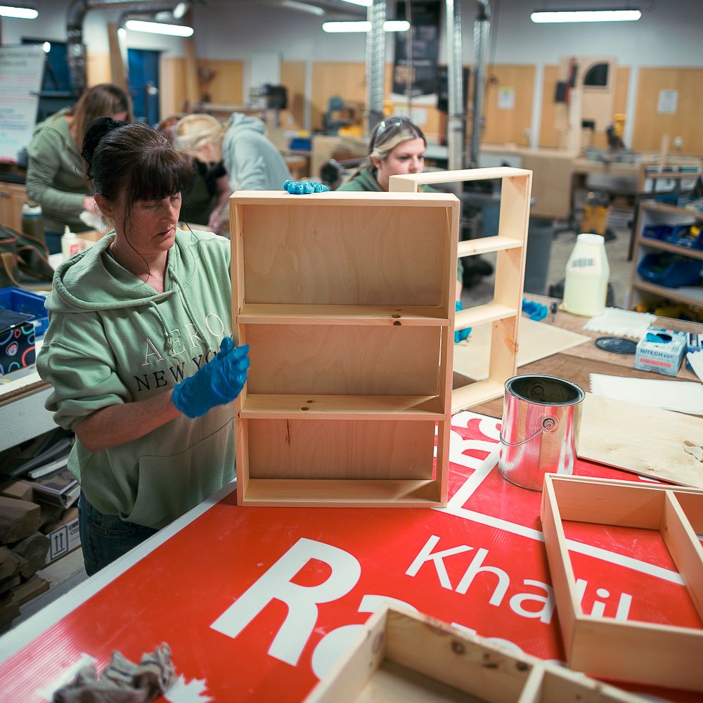 Woodworking 101 student completing her shelf design