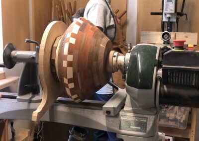 Turning machine with bowl made for segmented wood crafting with geometric designs