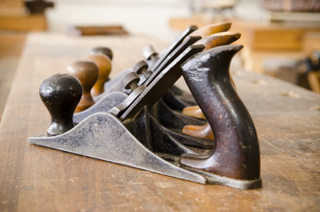 line of planers on a wood table