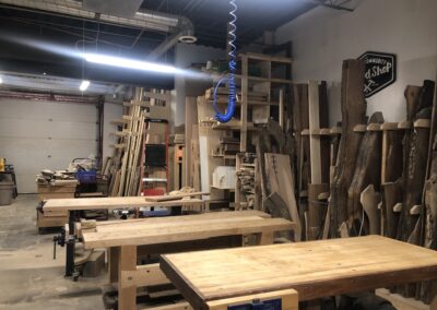 Three woodshop workstations within the interior of the woodshop